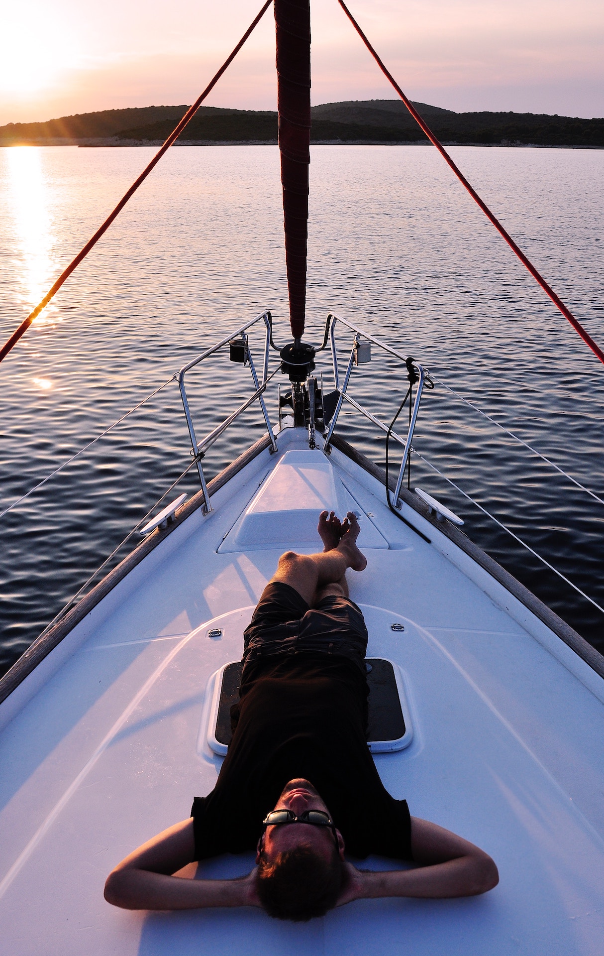 man laying on yacht